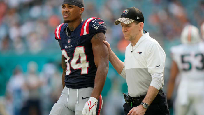 New England Patriots wide receiver Kendrick Bourne (84) leaves the field after being injured during the second half of an NFL football game against the Miami Dolphins, Sunday, Oct. 29, 2023, in Miami Gardens, Fla.